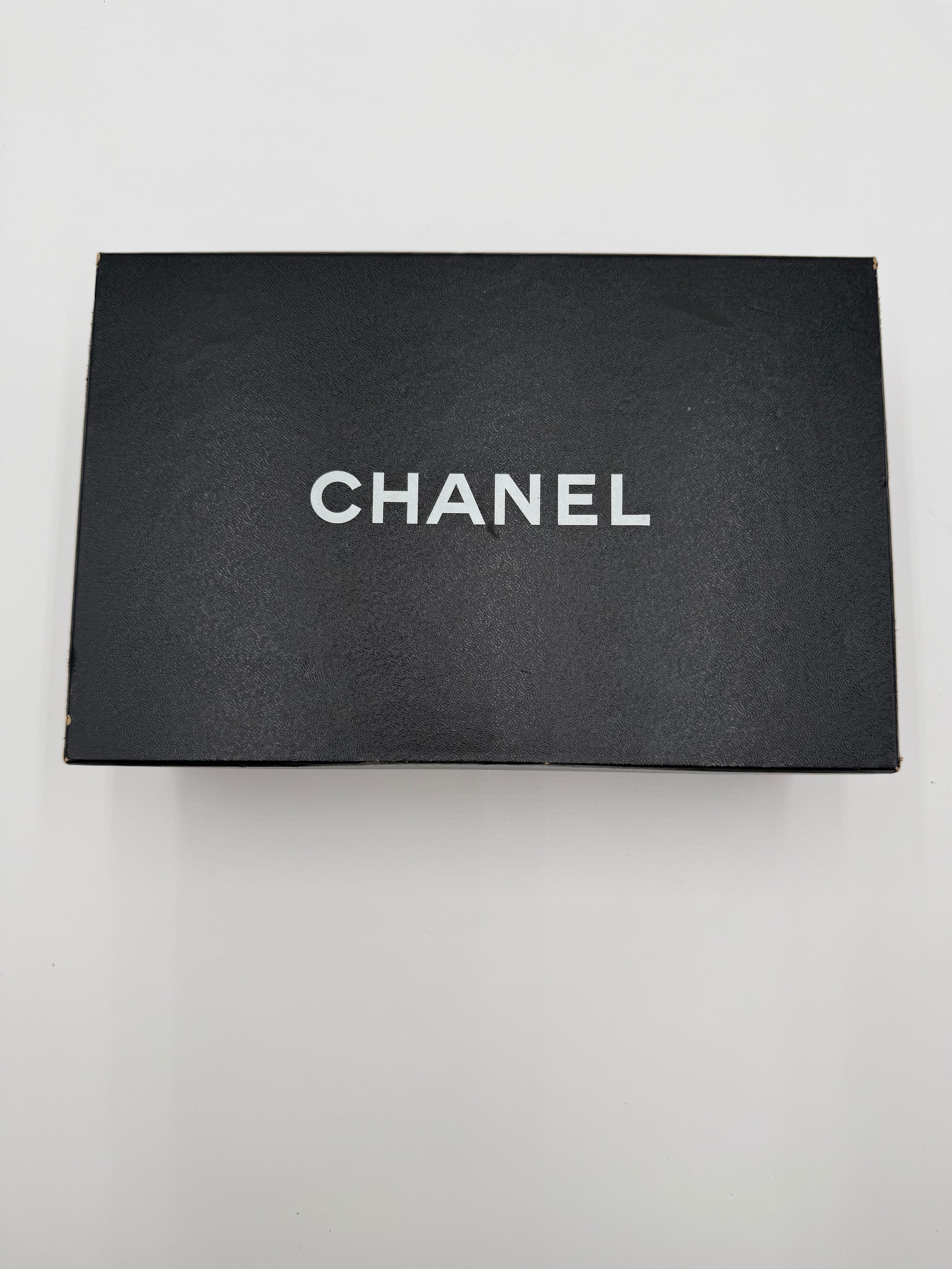 Chanel Black Leather and Patent Leather Cap-Toe Pumps